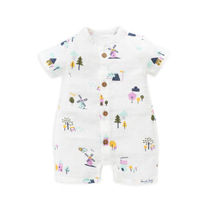 Organic muslin baby romper with colorful windmill print - front view showing button closure and short sleeves