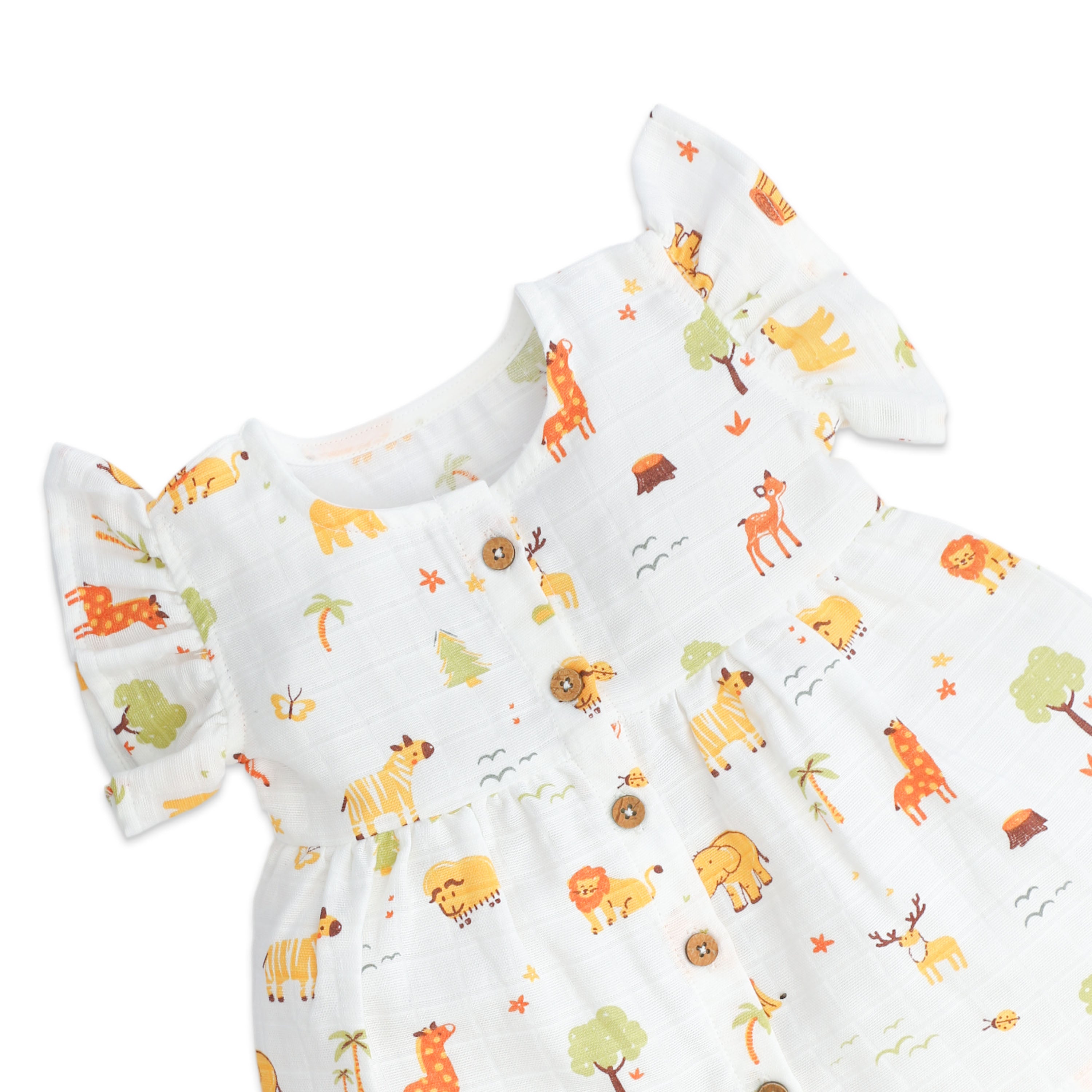 Baby girls frock with animal pattern on a white muslin fabric 