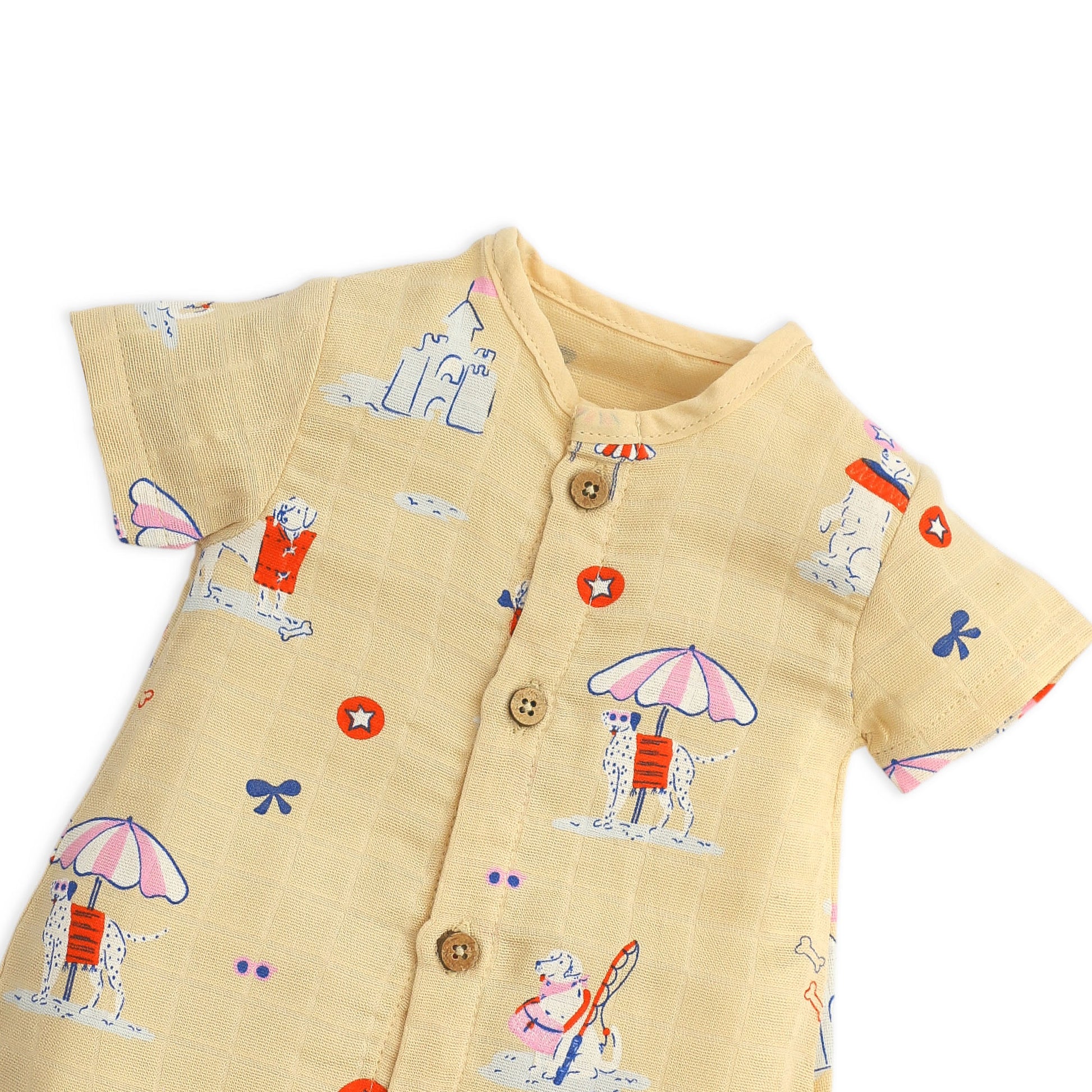 Close-up of premium muslin fabric texture and wooden button details on baby romper