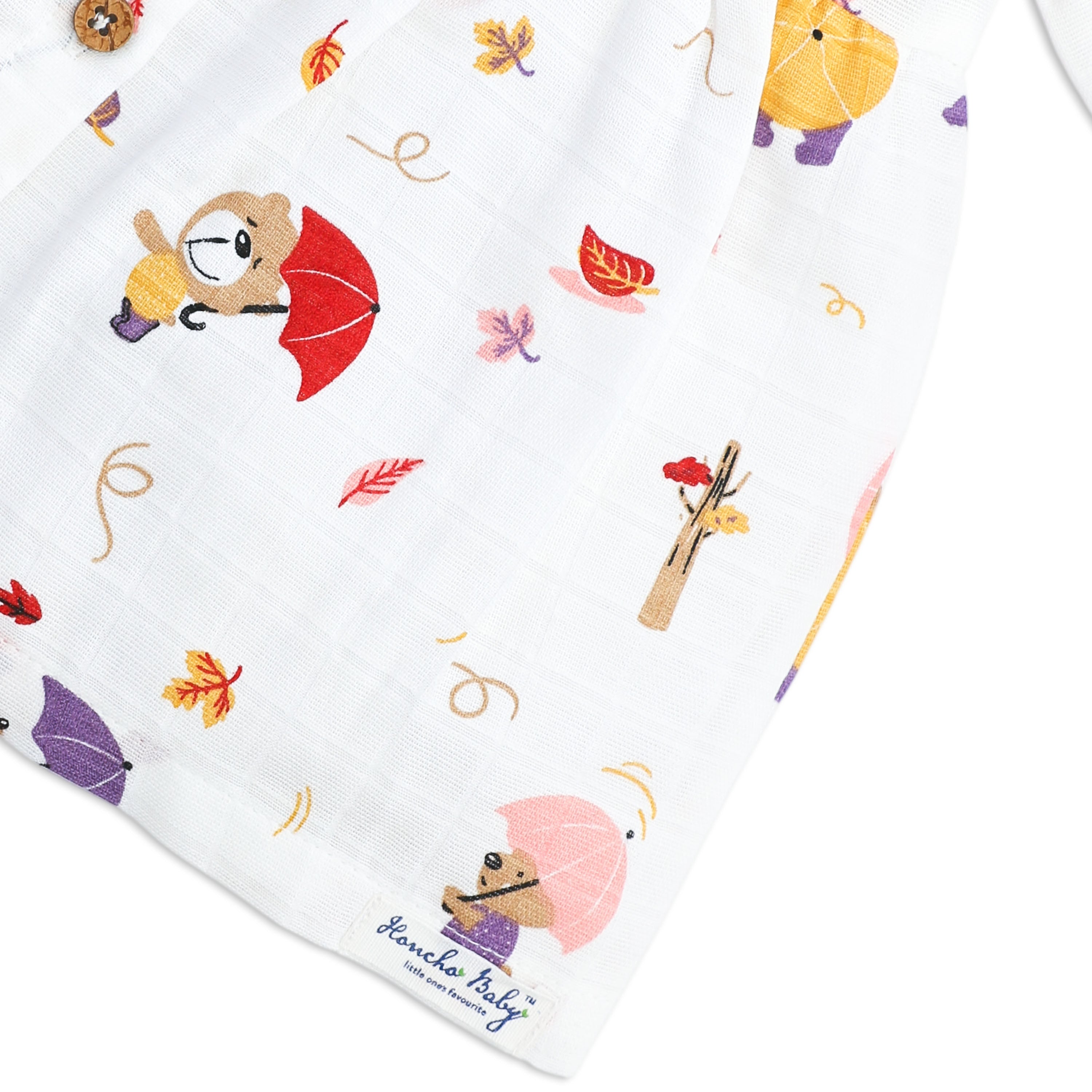 muslin fabric detail close-up with honcho baby branding