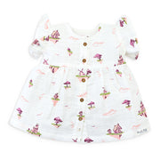 White baby girls dress with fantasy village print and puff sleeves